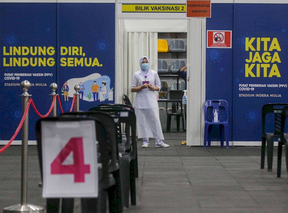 The second phase of vaccination under the National Immunisation Programme going smoothly according to schedule at the vaccination centre (PPV) Stadium Indera Mulia in Ipoh, Perak on June 4, 2021. u00e2u20acu201d Picture by Farhan Najib