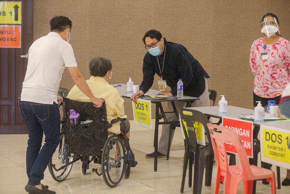 The second phase of vaccination under the National Immunisation Programme going smoothly according to schedule at the vaccination centre (PPV) Stadium Indera Mulia in Ipoh, Perak on June 4, 2021. u00e2u20acu201d Picture by Farhan Najib