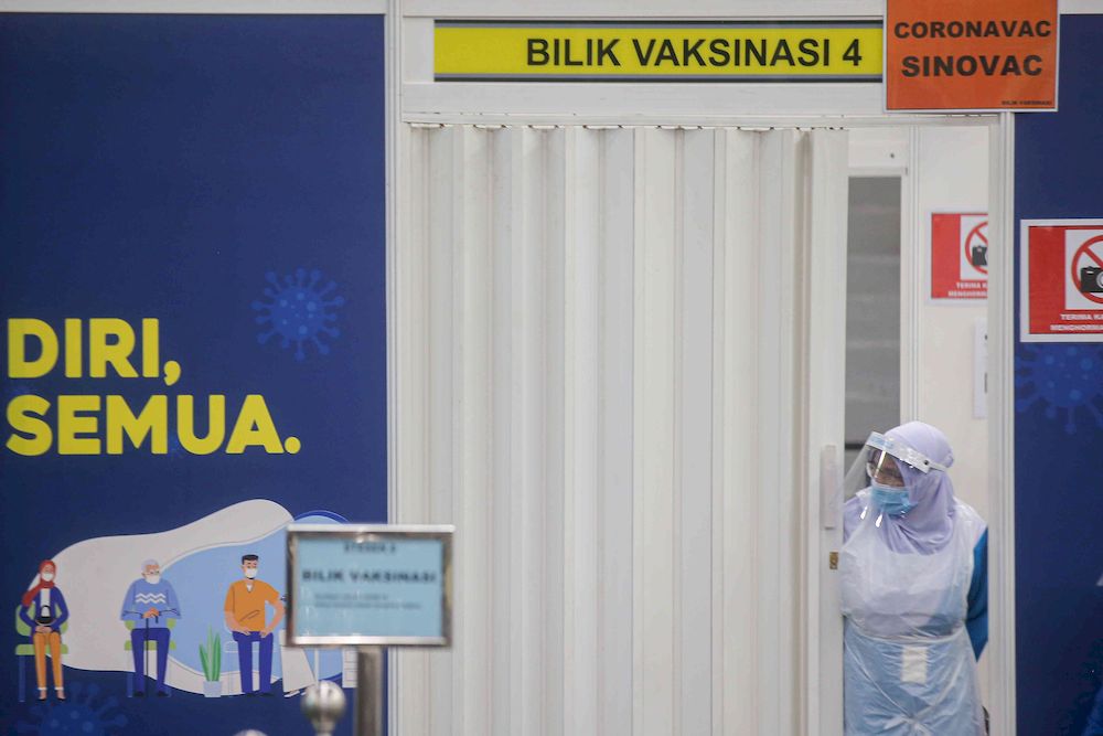 The second phase of vaccination under the National Immunisation Programme going smoothly according to schedule at the vaccination centre (PPV) Stadium Indera Mulia in Ipoh, Perak on June 4, 2021. u00e2u20acu201d Picture by Farhan Najib