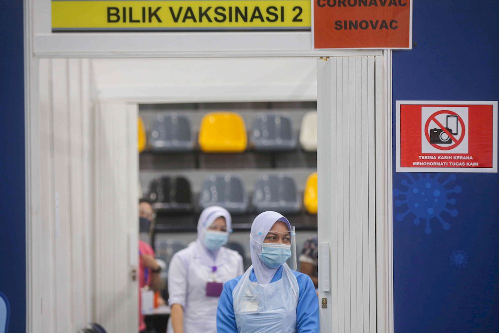 The second phase of vaccination under the National Immunisation Programme going smoothly according to schedule at the vaccination centre (PPV) Stadium Indera Mulia in Ipoh, Perak on June 4, 2021. u00e2u20acu201d Picture by Farhan Najib