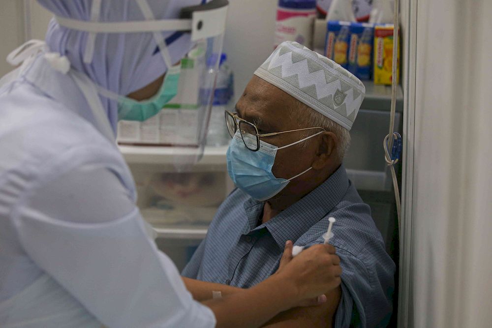 The second phase of vaccination under the National Immunisation Programme going smoothly according to schedule at the vaccination centre (PPV) Stadium Indera Mulia in Ipoh, Perak on June 4, 2021. u00e2u20acu201d Picture by Farhan Najib
