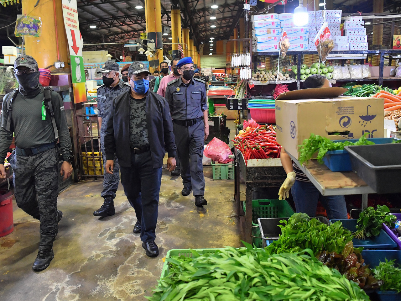 Deputy Home Minister Datuk Seri Ismail Mohamed Said and officers from the Immigration Department inspect the vicinity following a raid at the Selangor Wholesale Market in Serdang June 26, 2021. u00e2u20acu201d Bernama pic