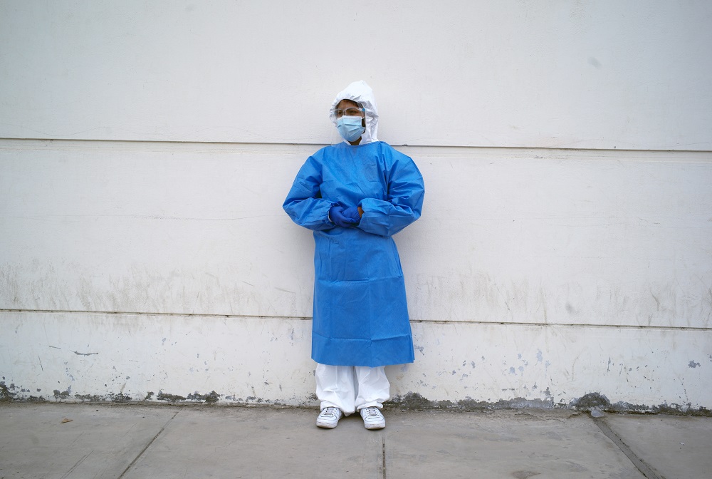 Hellen Nanez, whose father is being treated for Covid-19 in the Intensive Care Unit, poses for a photograph after seeing her father through a window at the hospital, in Pisco, Peru, May 11, 2021. u00e2u20acu2022 Reuters pic