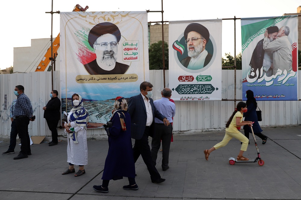 Banners of presidential candidate Ebrahim Raisi are seen during an election rally in Tehran, Iran June 14, 2021. u00e2u20acu2022 Majid Asgaripour/WANA (West Asia News Agency) via Reuters
