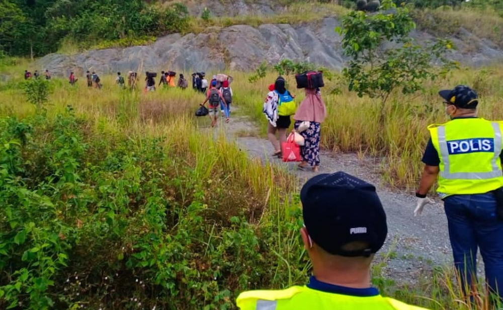 A group of undocumented Indonesians were deported after they were caught entering the state through rat trails along the Sarawak-Kalimantan border June 21, 2021. u00e2u20acu201d Picture courtesy of Deputy Chief Ministeru00e2u20acu2122s Office
