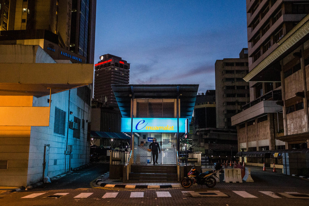 A customer at a Bank Muamalat ATM branch in Kuala Lumpur June 24, 2021. u00e2u20acu201d Picture by Firdaus Latif 