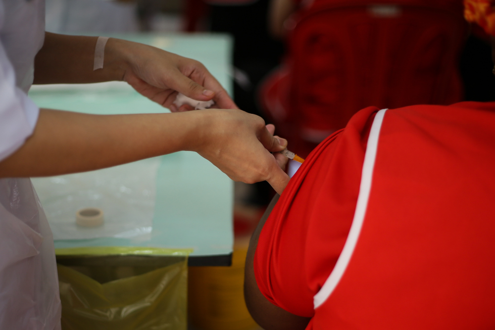 Staff and residents of Rumah Amal Cheshire receive the Covid 19 vaccine jab at Rumah Amal Cheshire Selangor, June 24, 2021. u00e2u20acu201d Picture by Ahmad Zamzahuri