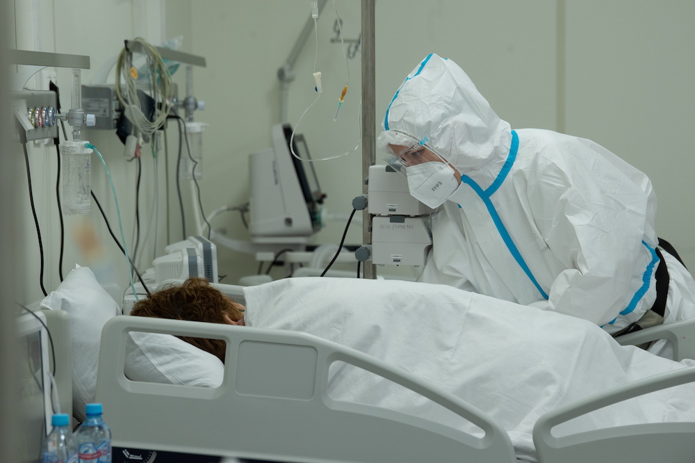 A medical worker takes care of a patient at a temporary hospital in the Krylatskoye Ice Palace, where patients suffering from the coronavirus disease are treated, in Moscow, Russia June 11, 2021. u00e2u20acu2022 Reuters picnn