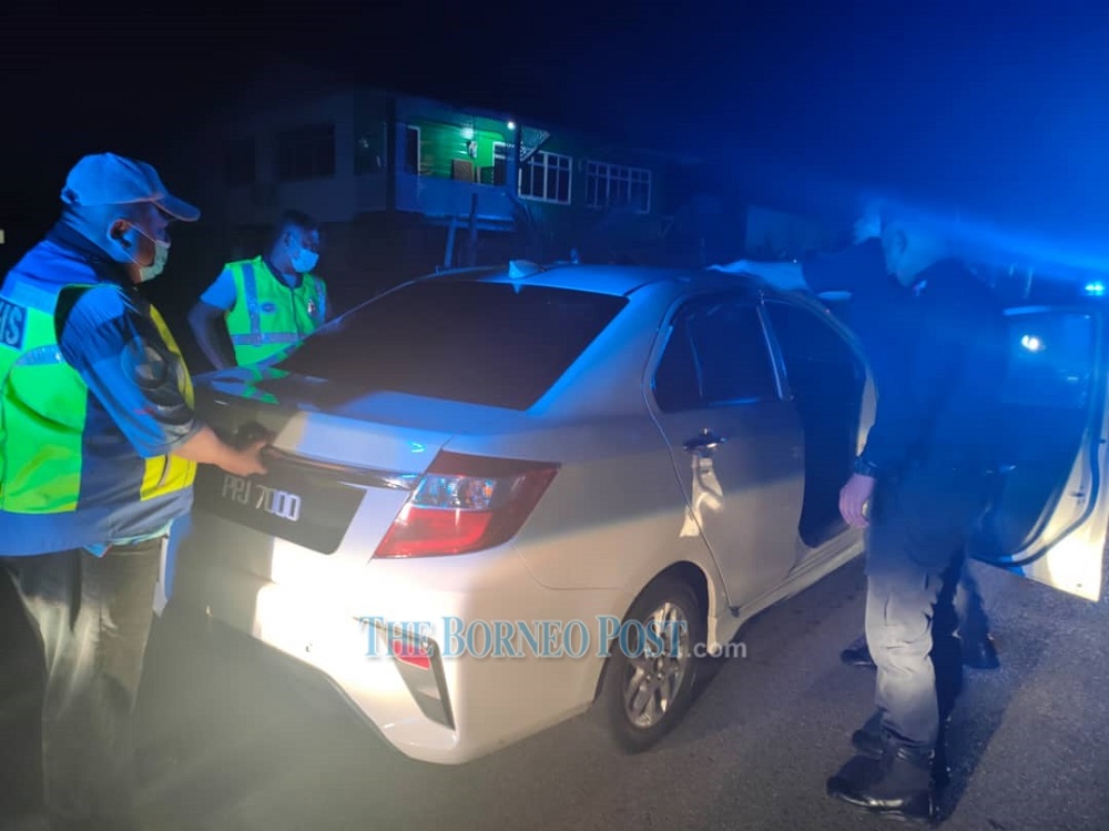 Police checking the rented car involved in the high speed pursuit at Lane 4 Jalan Sentosa at Salim. u00e2u20acu201d Borneo Post Online pic