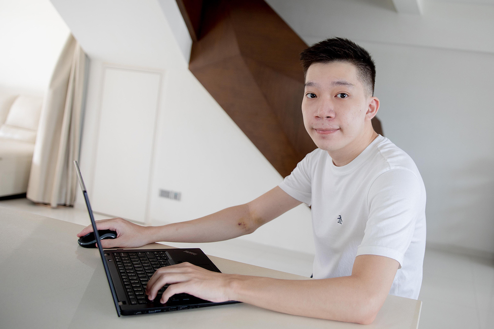 Mr Andrew Lee, 24, works at a logistics firm under the SGUnited Traineeship Programme. He will be converted to a full-time software developer executive in July. — Photo by Ili Nadhirah for TODAY