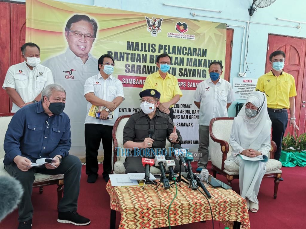 Abang Johari (centre) speaking to the reporters during a press conference. He was accompanied by Awang Tengah (left), Fatimah (second right) and others. u00e2u20acu2022 Borneo Post pic