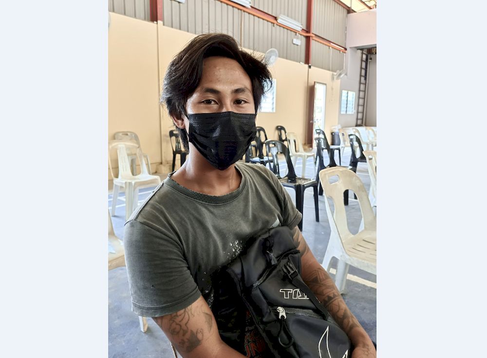 Sim Jiunn Tie, 26, from Linjai, Batang Lassa has to take an-hour boat ride to reach the Bawang Assan Community Hall in Sibu, Sarawak, to receive the Covid-19 vaccine injection, June 14, 2021. u00e2u20acu201d Bernama pic