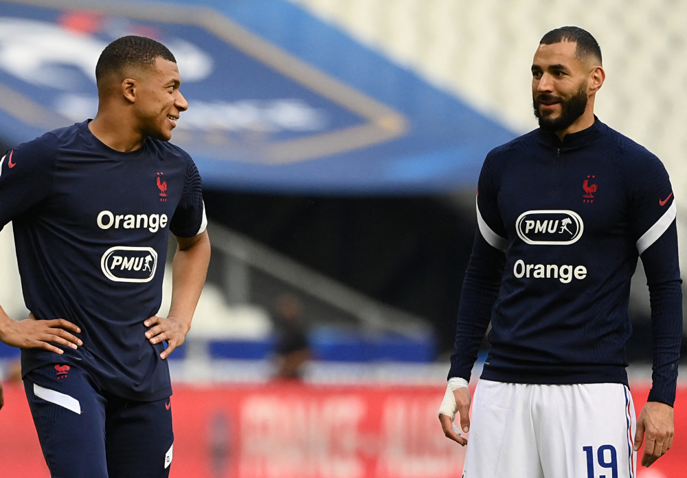Franceu00e2u20acu2122s forwards Karim Benzema and Kylian Mbappe warm up before the friendly football match between France and Bulgaria at Stade De France in Saint-Denis, June 8, 2021, ahead of the Uefa Euro 2020 European Championships. u00e2u20acu201d AFP pic 