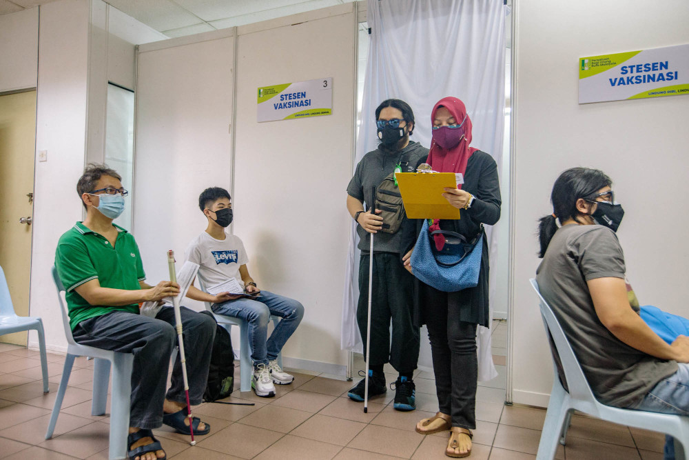 A blind man is seen after receiving the Covid-19 vaccine as part of the vaccination campaign at the Malaysian Association for the Blind (MAB) headquarters in Kuala Lumpur, June 4, 2021. u00e2u20acu201d  Picture by Firdaus Latif