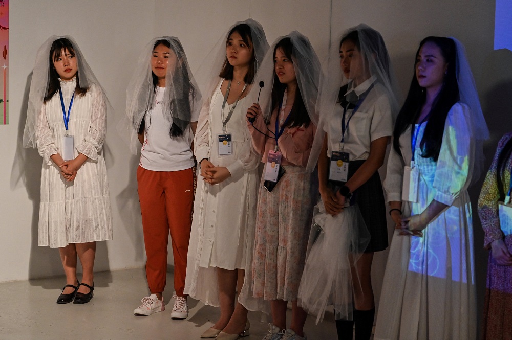 This photo taken on May 14, 2021 shows eating disorder campaigner Zheng Qinwen (left) during the presentation of an anti body-shaming exhibition, at the Himalaya Museum in Shanghai. u00e2u20acu2022 AFP pic