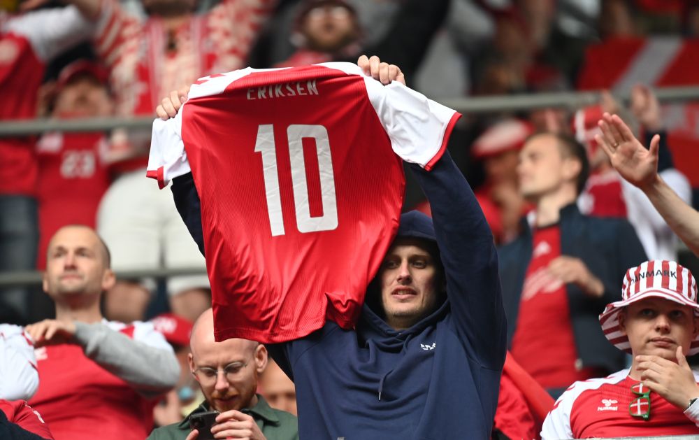 A Denmark fan holds up a Christian Eriksenu00e2u20acu2122s shirt during the match against Finland at the Parken Stadium, Copenhagen June 12, 2021. u00e2u20acu201d Reuters pic