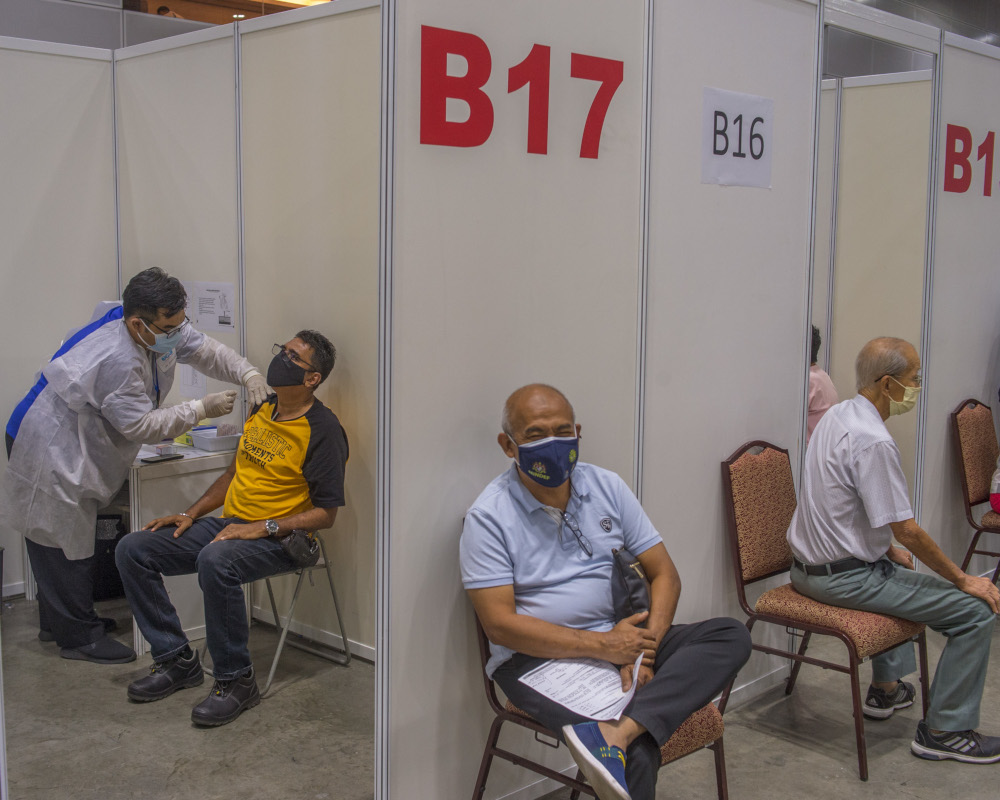 People receive their Covid-19 vaccines during the National Covid-19 Immunisation Programme at Kuala Lumpur Convention Centre in Kuala Lumpur June 8, 2021. u00e2u20acu201d Picture by Shafwan Zaidon