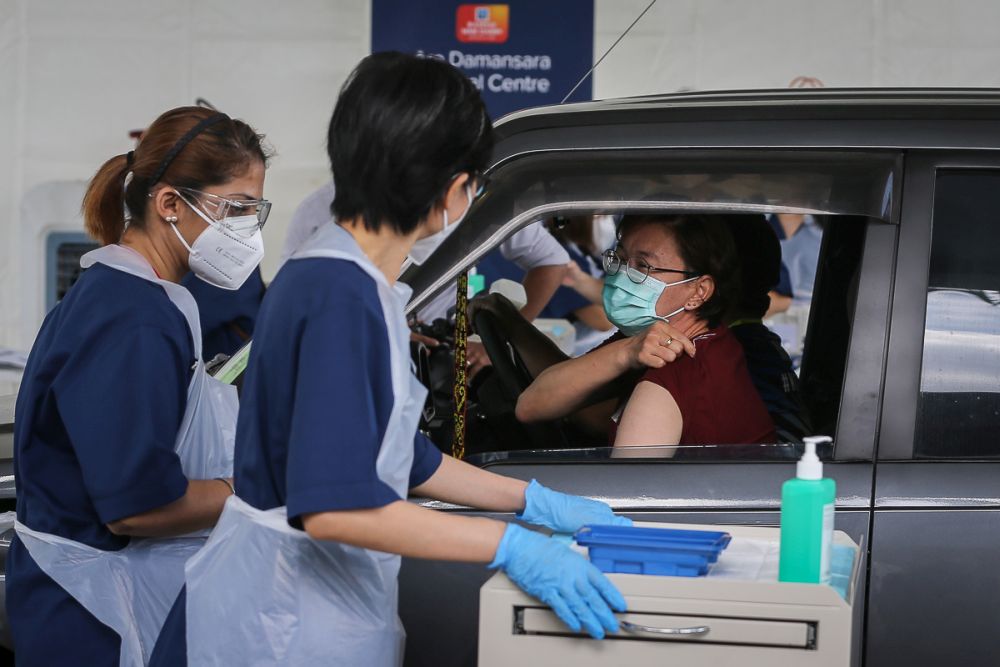 nThe disabled receive their Covid-19 jabs at Menara Sime Darby Plantation in Ara Damansara June 4, 2021. u00e2u20acu201d Picture by Yusof Mat Isan