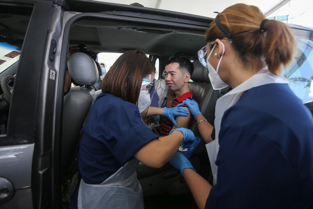 nThe disabled receive their Covid-19 jabs at Menara Sime Darby Plantation in Ara Damansara June 4, 2021. u00e2u20acu201d Picture by Yusof Mat Isan