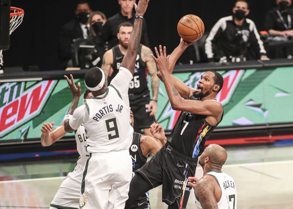 Brooklyn Nets forward Kevin Durant (7) shoots over Milwaukee Bucks centre Bobby Portis (9) in the third quarter during game two in the second round of the 2021 NBA Playoffs June 7, 2021. u00e2u20acu201d Reuters pic