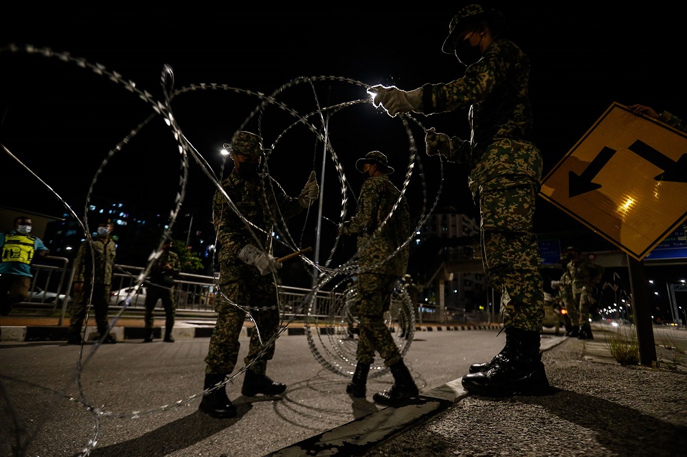 Armed Forces personnel cordon off the vicinity of Bayan Lepas with barbed wire June 4, 2021. u00e2u20acu201d Picture by Sayuti Zainudin