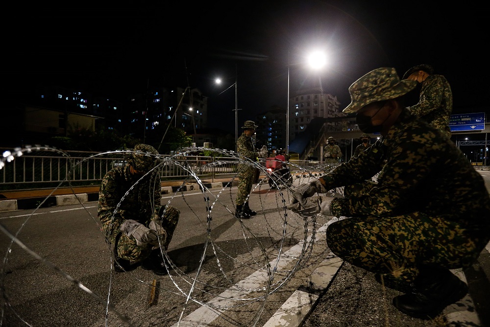 Armed Forces personnel cordon off the vicinity of Bayan Lepas with barbed wire June 4, 2021. u00e2u20acu201d Picture by Sayuti Zainudin