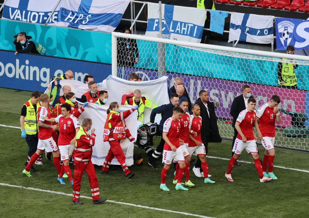 Denmark's Christian Eriksen is stretchered off the pitch after collapsing during the match. u00e2u20acu201d Reuters pic