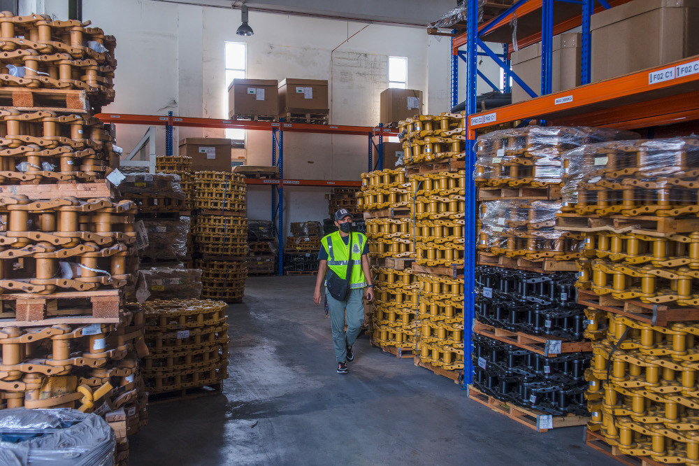 A factory supplying heavy machinery equipment adheres to SOPs following the implementation of MCO 3.0 in Segambut, Kuala Lumpur. u00e2u20acu201d Picture by Shafwan Zaidon