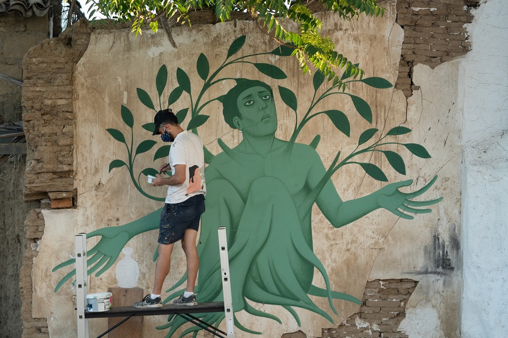 Greek artist Fikos, who describes himself as a u00e2u20acu02dcneo-muralist,u00e2u20acu2122 works on one of his murals in the Cypriot capital Nicosia. u00e2u20acu2022 AFP pic via ETX Studio