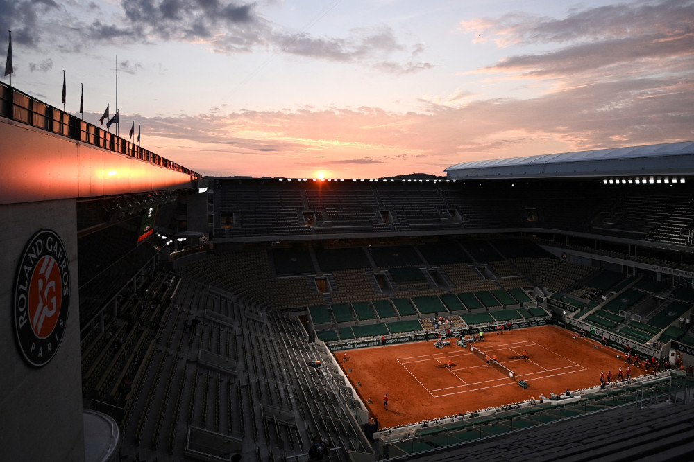 Members of the ground staff prepare the Philippe Chatrier court ahead of a singles second round tennis match on Day 5 of The Roland Garros 2021 French Open tennis tournament in Paris June 3, 2021. u00e2u20acu201d AFP pic 