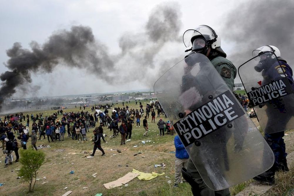 Riot police officers stand during clashes outside a camp in the town of Diavata in northern Greece, April 6, 2019. u00e2u20acu201d Reuters pic