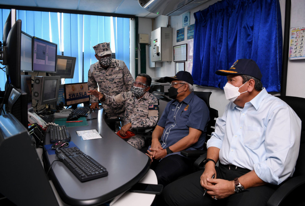Home Minister Datuk Seri Hamzah Zainudin with MMEA director-general Admiral (Maritime) Datuk Mohd Zubil Mat Som at the Malaysian Maritime Sea Surveillance System in Port Klang, June 8, 2021. u00e2u20acu201d Bernama pic 