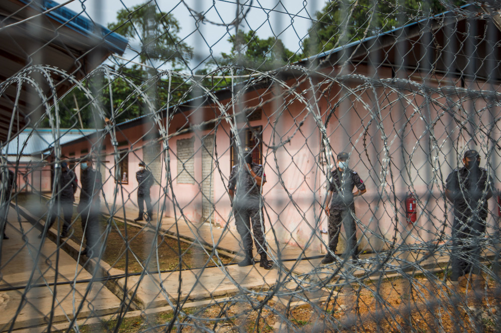 Immigration officers guarding the Beranang Satellite Prison and Immigration Depot in Beranang, June 3, 2021. u00e2u20acu201d Picture by Shafwan Zaidonn