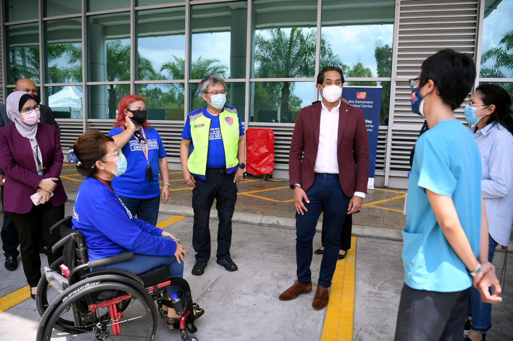 National Covid-19 Immunisation Programme Coordinating Minister Khairy Jamaluddin with OKU Sentral president Senator Datuk Ras Adiba Radzi at the vaccination centre located at Menara Sime Darby Plantation in Ara Damansara, June 15, 2021. u00e2u20acu201d Bernama pic 