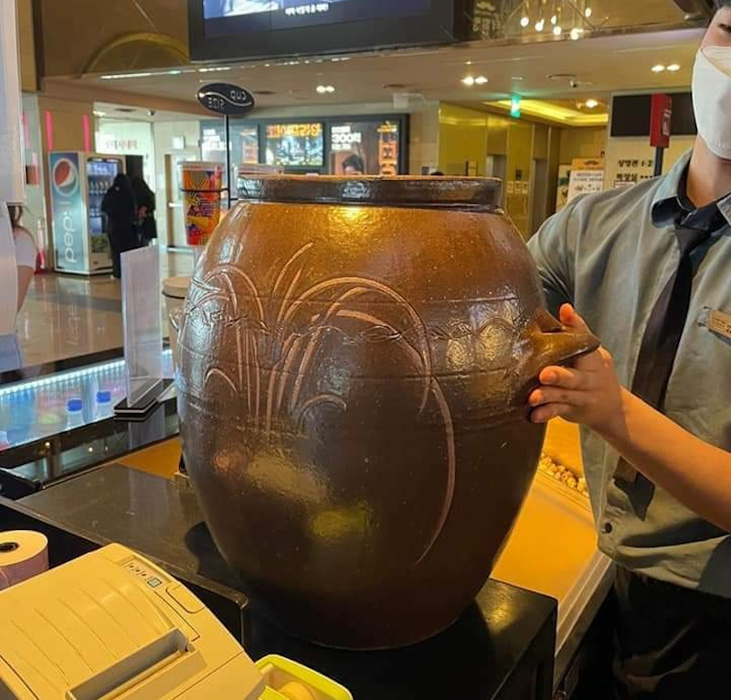 Kimchi jars are used to purchase popcorns on sale at a Korean cinema chain in conjunction with World Environment Day. u00e2u20acu201d Photo via Twitter/ @wtfmomone 