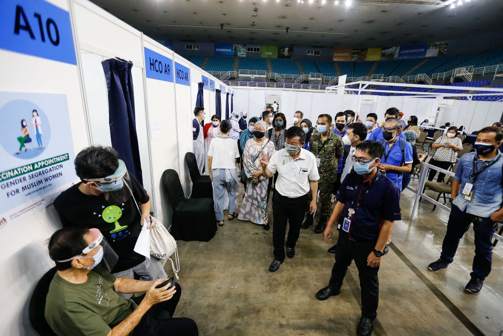 Penang Chief Minister Chow Kon Yeow greets members of the public during a visit to the Covid-19 vaccination centre at the  Spice Arena, Bayan Baru June 6, 2021. u00e2u20acu201dPicture by Sayuti Zainudin