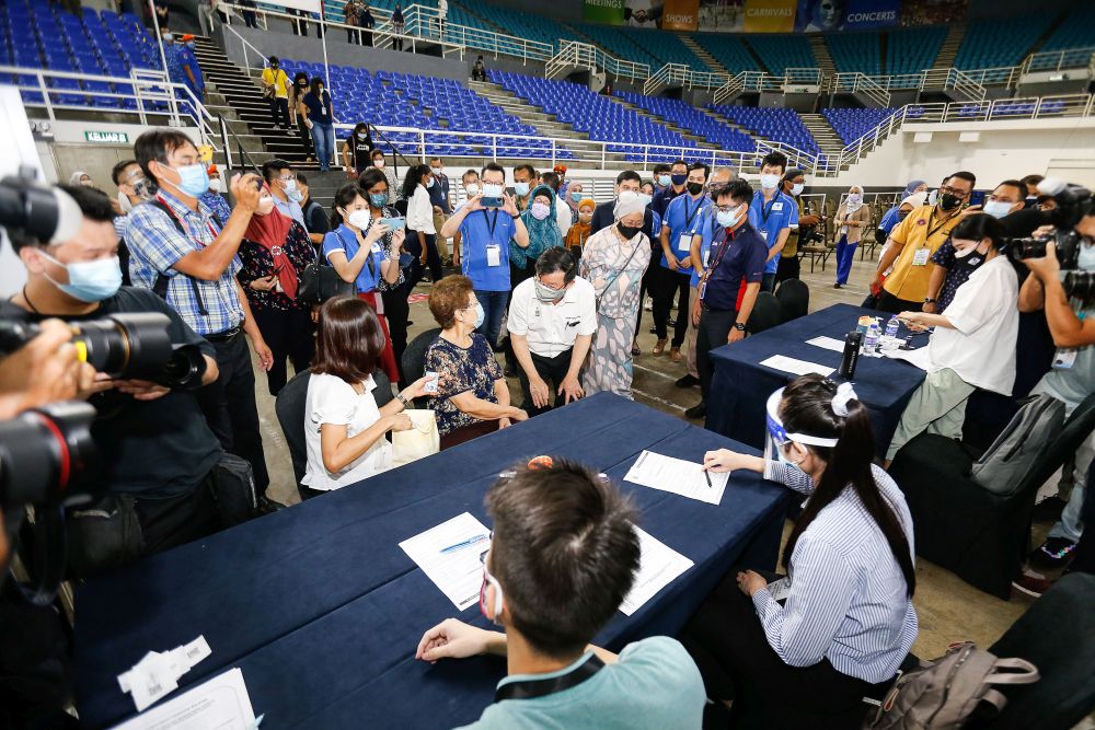 Penang Chief Minister Chow Kon Yeow speaks to members of the public during a visit to the Covid-19 vaccination centre at the  Spice Arena, Bayan Baru June 6, 2021. u00e2u20acu201dPicture by Sayuti Zainudin