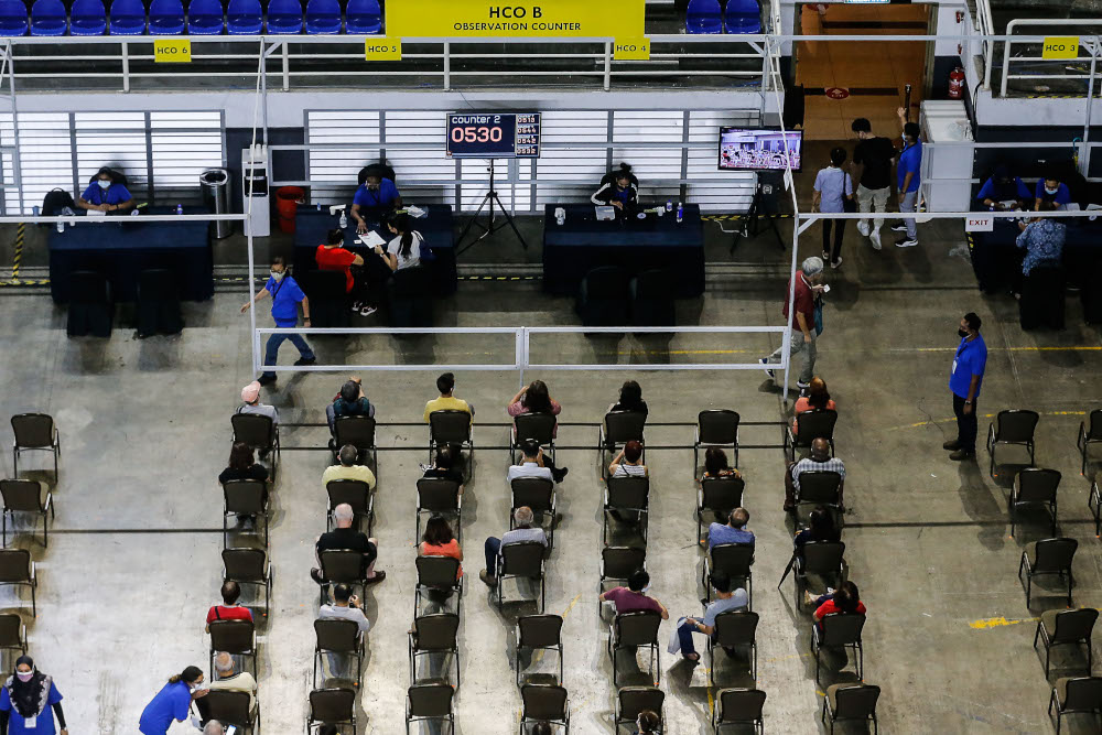 Vaccine recipients wait for their turn at the vaccine distribution centre, SPICE, June 10, 2021. u00e2u20acu201d Picture by Sayuti Zainudin