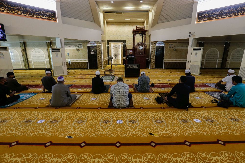 Muslims observe MCO SOPs during Friday prayers at the Al-Malik Khalid Mosque in Universiti Sains Malaysia, Penang June 4, 2021. u00e2u20acu201d Picture by Sayuti Zainudin