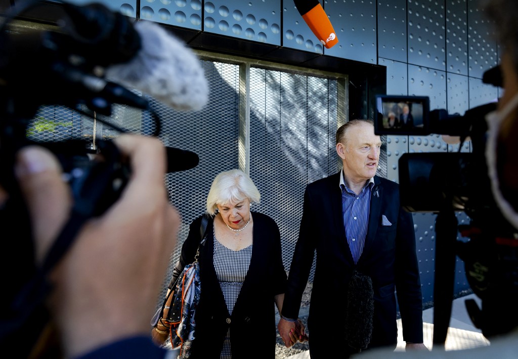 Relatives Evert van Zijtveld and his partner arrive on June 7, 2021 at the Judicial Complex Schiphol in Badhoevedorp, where judges will start hearing evidence against suspects in the 2014 downing of Malaysia Airlines flight MH17 over Ukraine, in which all