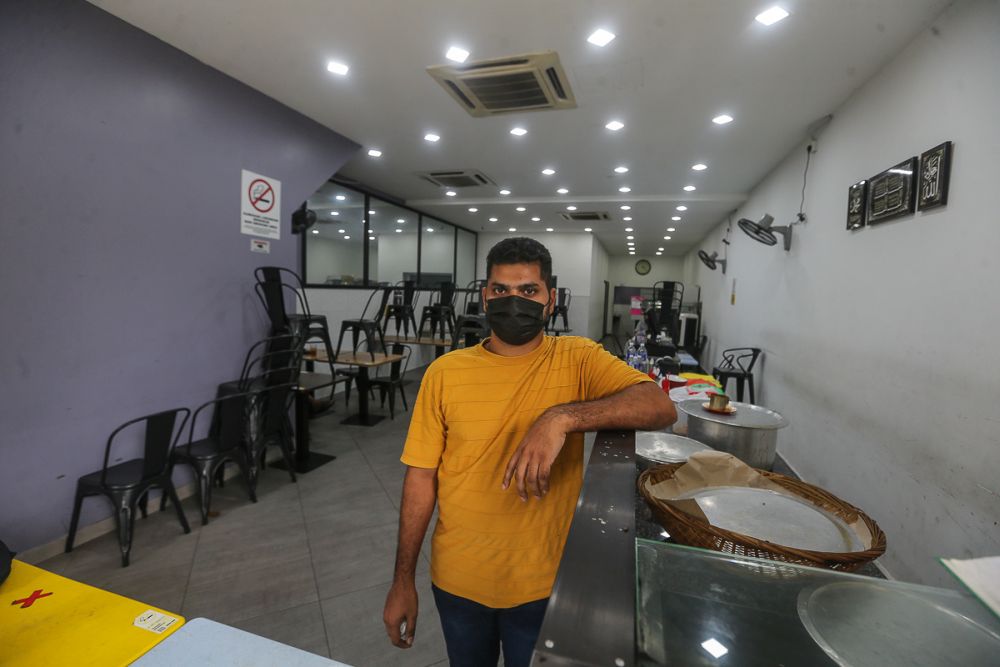 Sham speaks to Malay Mail during an interview at Kari Kepala Ikan Anuar on Jalan Dang Wangi June 14, 2021. — Picture by Yusof Mat Isa