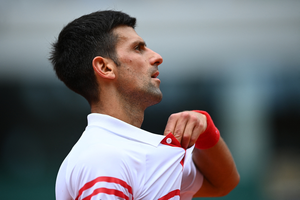 Serbiau00e2u20acu2122s Novak Djokovic reacts during his menu00e2u20acu2122s singles fourth round tennis match against Italyu00e2u20acu2122s Lorenzo Musetti on Day 9 of The Roland Garros 2021 French Open tennis tournament in Paris June 7, 2021. u00e2u20acu201d AFP picnn