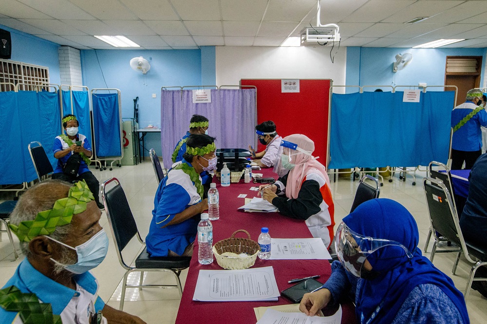 People from the Orang Asli community receive the first dose of the Covid-19 vaccine in Gombak June 19, 2021. u00e2u20acu2022 Picture by Firdaus Latif