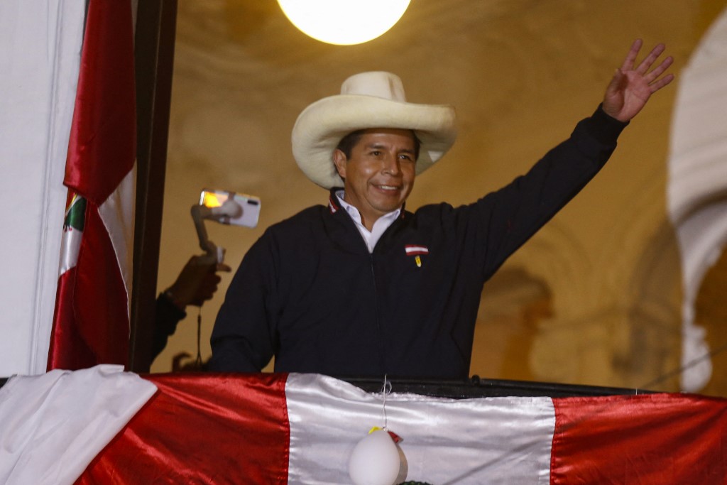 Peruvian leftist presidential candidate Pedro Castillo of Peru Libre waves to supporters from his party headquartersu00e2u20acu2122 balcony in Lima on June 8, 2021. u00e2u20acu201d AFP pic