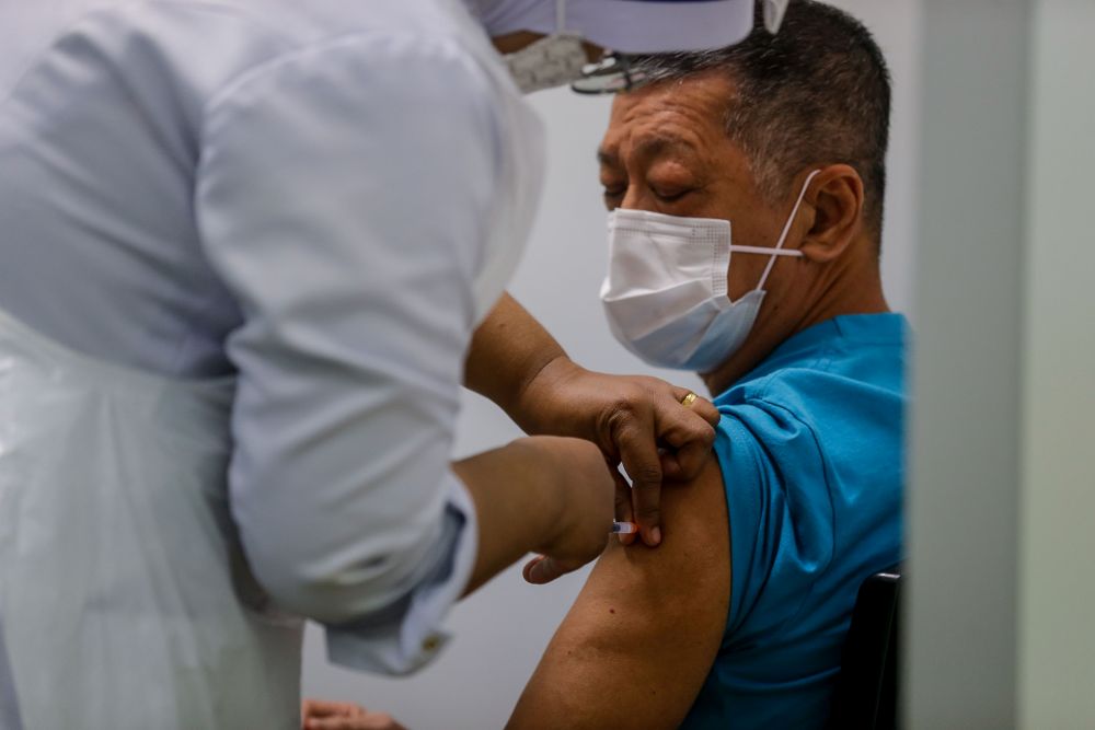 A nurse administers a dose of the Covid-19 vaccine at Pesta Penang, Bayan Lepas June 8, 2021. u00e2u20acu201d Picture by Sayuti Zainudin