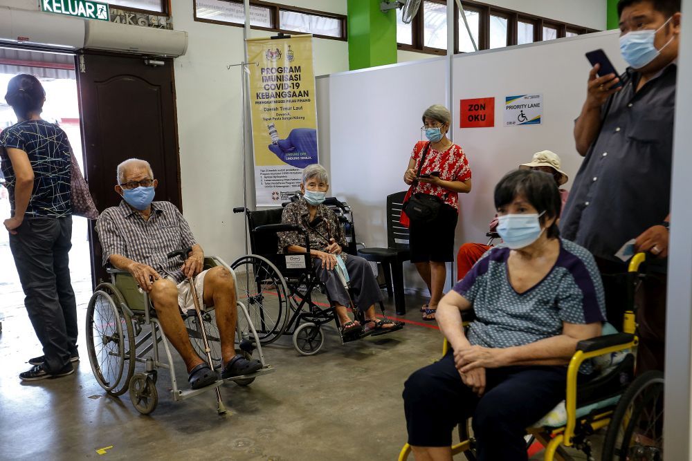 Senior citizens wait to receive their Covid-19 vaccine jab at Pesta Penang, Bayan Lepas June 8, 2021. u00e2u20acu201d Picture by Sayuti Zainudinnn