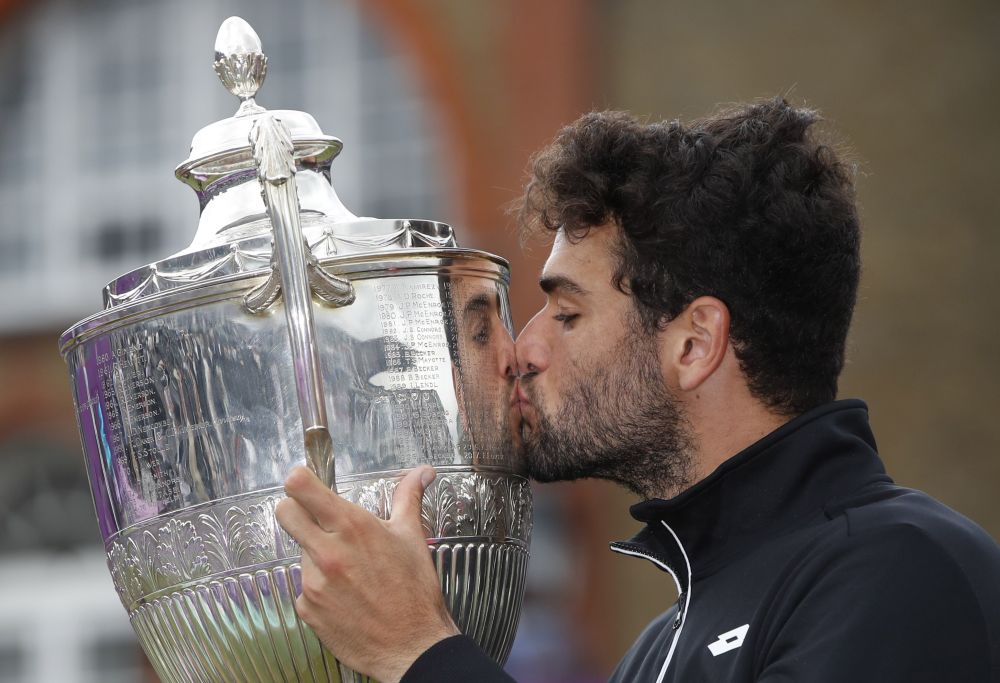 Italy's Matteo Berrettini poses as he celebrates winning the final match against Britain's Cameron Norrie at the Queenu00e2u20acu2122s Club, London June 19, 2021. u00e2u20acu201d Reuters pic