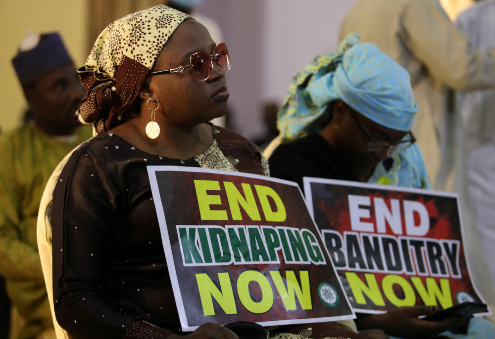 A demonstrator holds a sign during a protest to urge authorities to rescue hundreds of abducted schoolboys, in north-western state of Katsina, Nigeria, December 17, 2020. u00e2u20acu201d Reuters pic