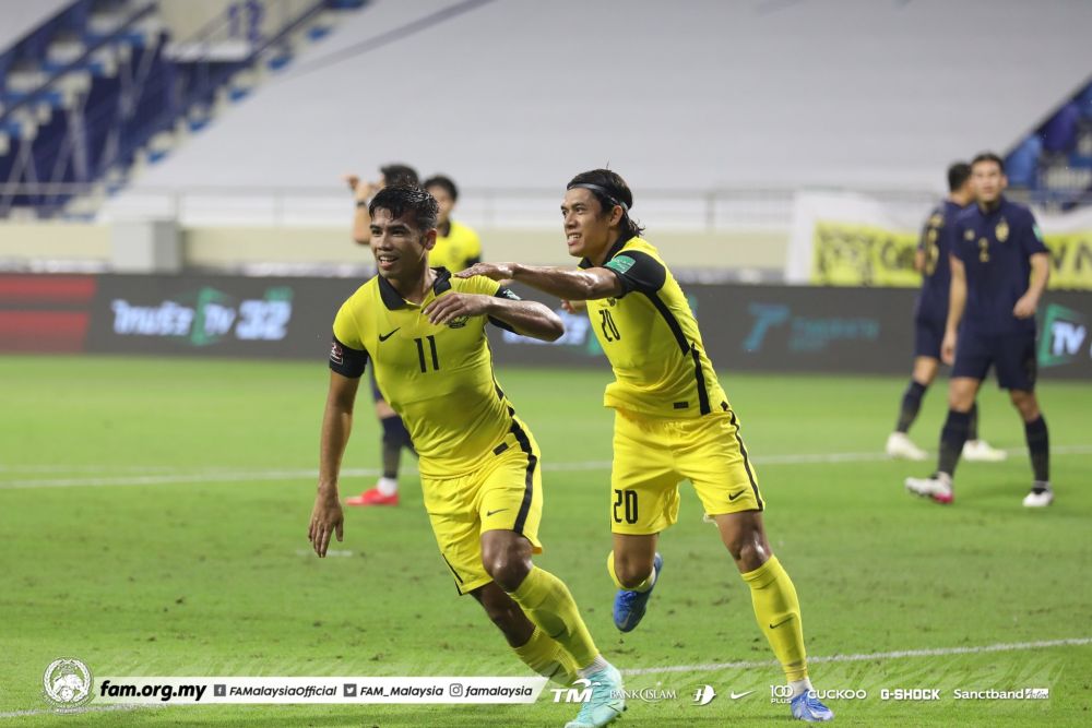 Muhammad Safawi (left) celebrates after scoring from the penalty spot against Thailand at the Al Maktoum Stadium in Dubai June 16, 2021. u00e2u20acu201d Picture via Twitter