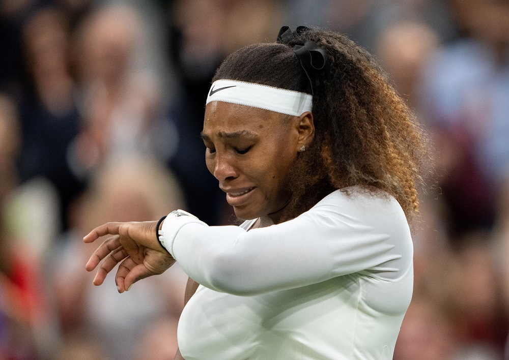 Serena Williams reacts after sustaining an injury before retiring from her first round match against Belarus' Aliaksandra Sasnovich in London June 29, 2021. u00e2u20acu2022 Pool via Reuters/Jed Leicester